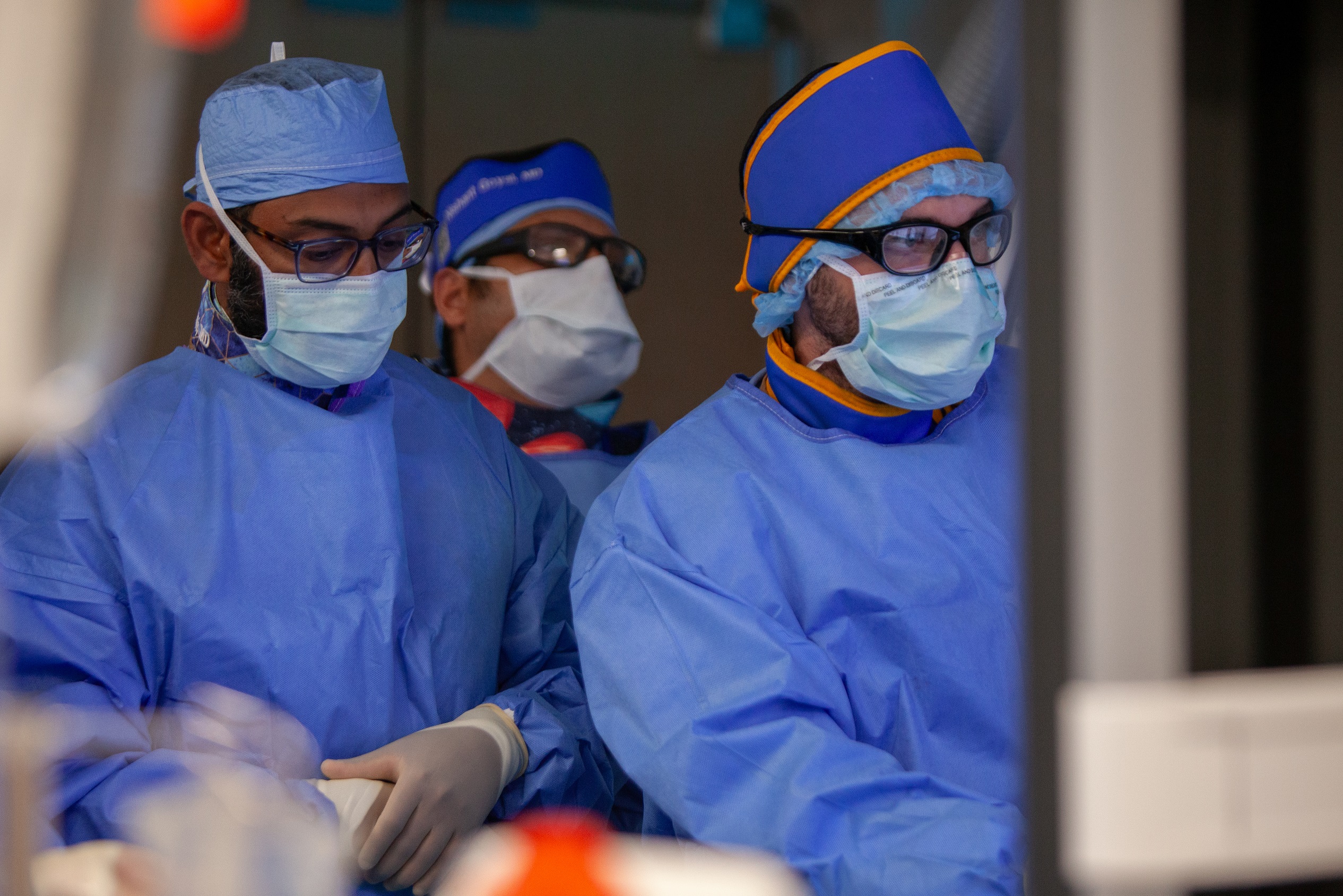 Dr. Grandhi and others performing endovascular surgery