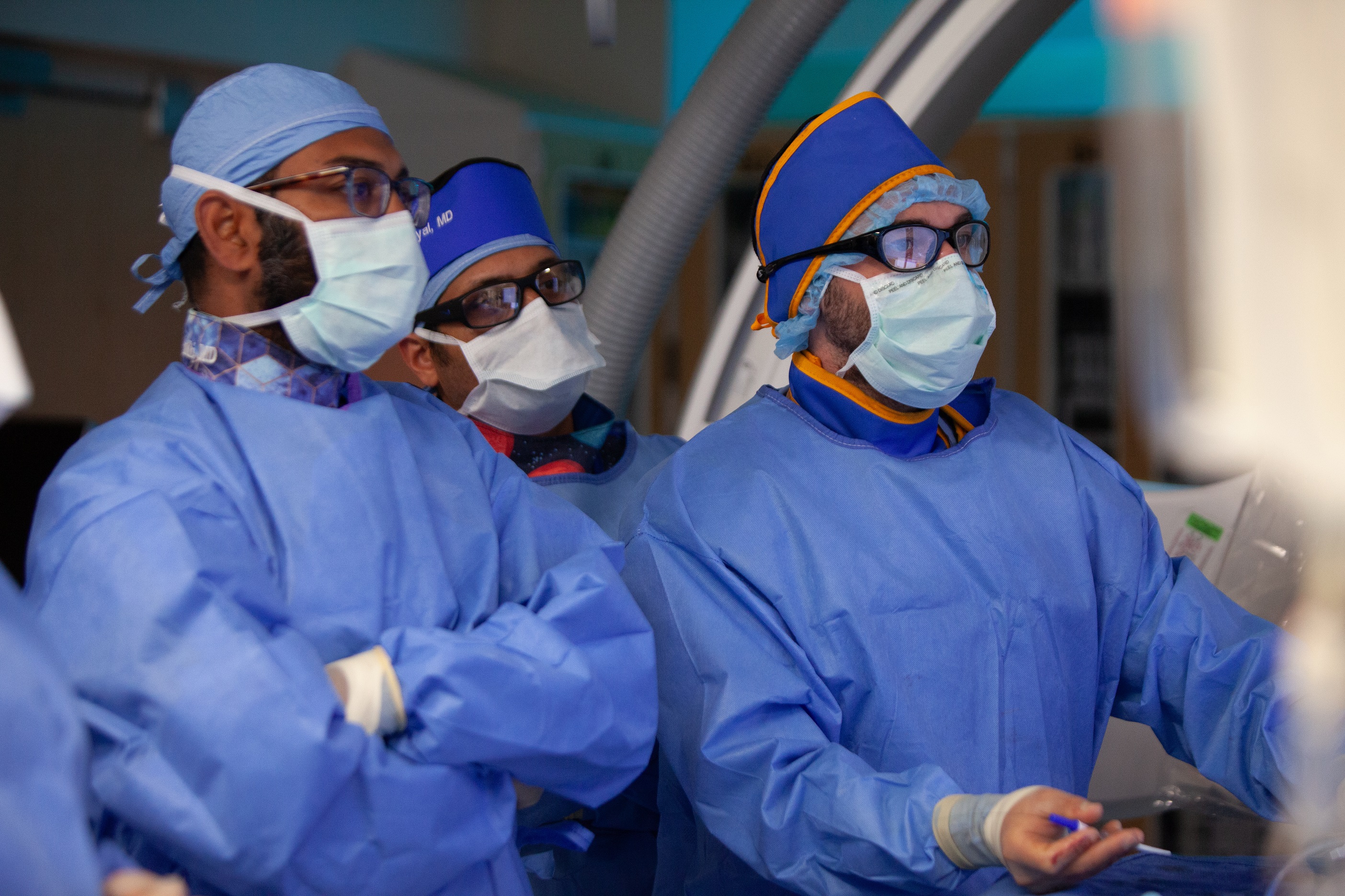 Dr. Grandhi and others performing endovascular surgery